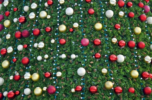 Christmas pine, decorated with colorful balloons. Fragment, close-up.