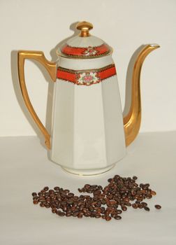 Coffeepot of the years 1940/50 with coffee beans. Collector's item