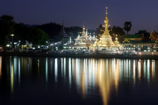 Burmese Architectural Style of Wat Chong Klang (r) and Wat Chong Kham (l) at dusk. Mae Hong Son, Northern Thailand