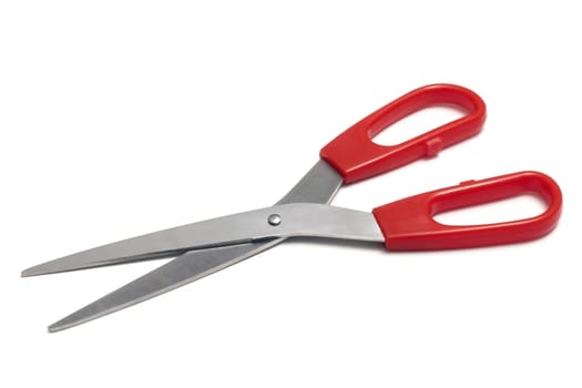 Red handled scissors isolated on a white background.