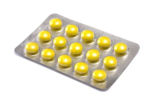 Package of Yellow Pills isolated on white