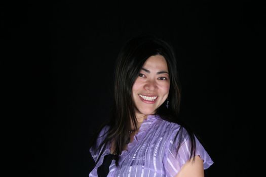 Beautiful multi-racial woman isolated on black background
