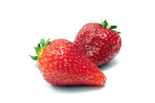 Two strawberries isolated on white background