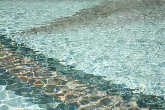 Shimmering swimming pool sports water background with marble pattern