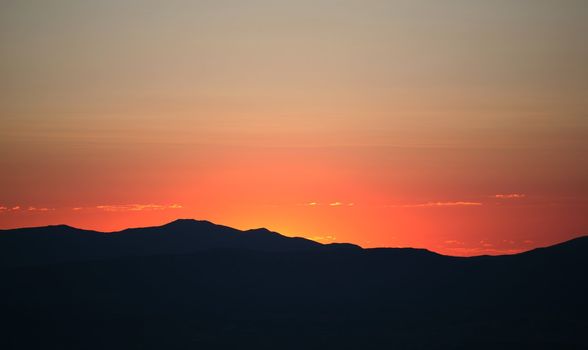 Colorful sky with mountains