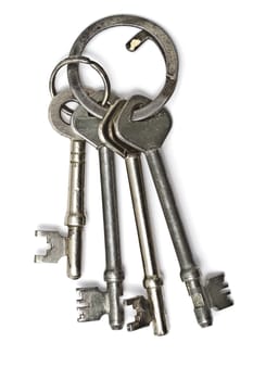 A bunch of old keys isolated on white background