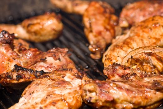 barbecue chicken on the grill with sauce