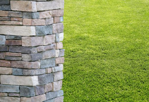 Column or pillar with green grass background at a park