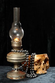 NECKLACE FROM PEARLS on an oil lamp
