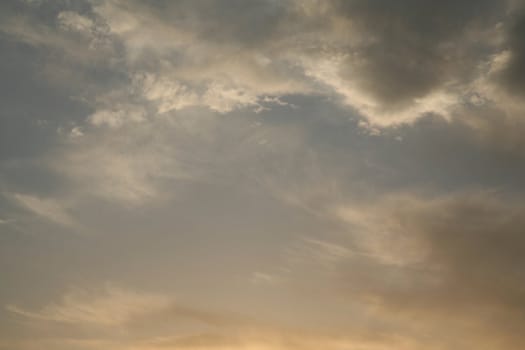 Golden sky with dark clouds