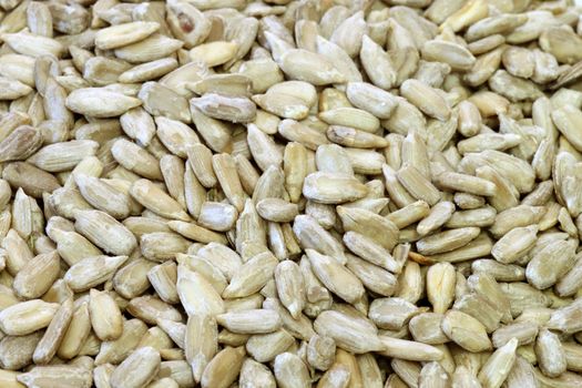 Sunflower seeds make natural texture. Shot in studio.