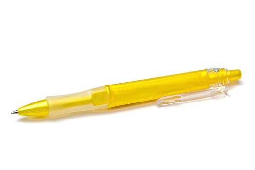 Yellow pen closeup on the white background 
