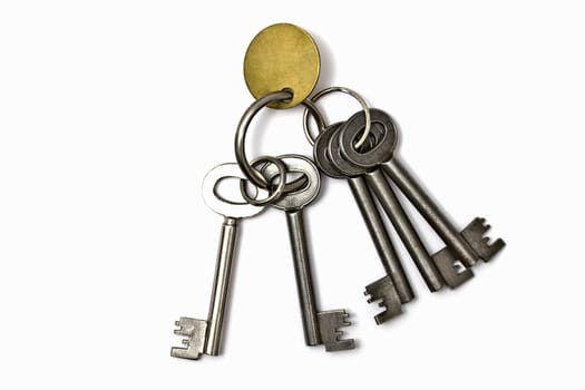 A bunch of old keys isolated on white background 

