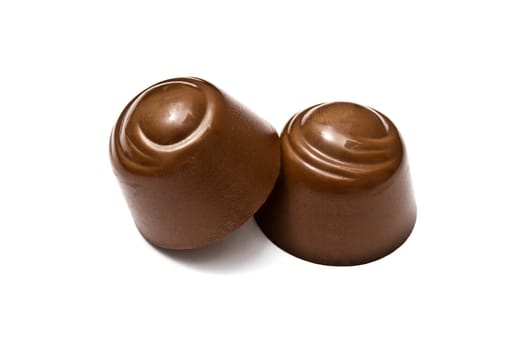 Delicious chocolates isolated on white background
