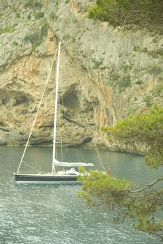 sailing boat in a lonley ocean bay in mallorca spain