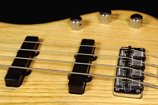 wood finish four string electric bass guitar