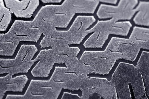 winter frost on worn car tire