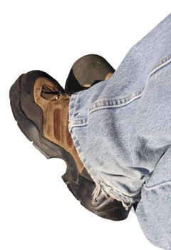 Isolated denim pant legs and work boots