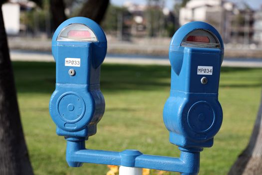 Set of two parking meters at a park
