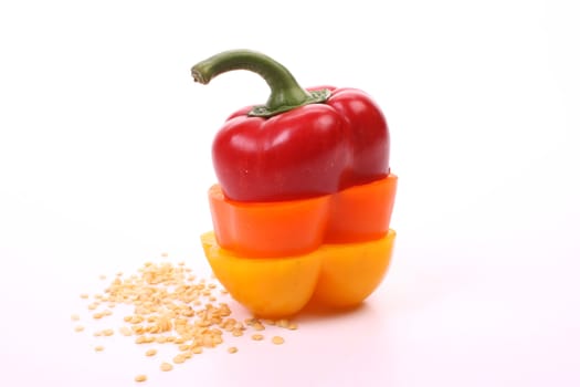 Three sorts of bell pepper combined into one, over white