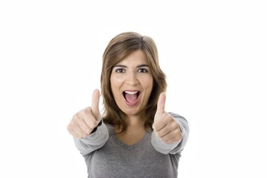 Portrait of an attractive young woman with thumbs up. - Isolated on white
