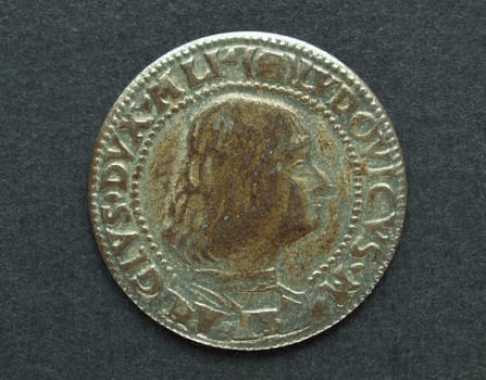Ancient Roman coin on a black background
