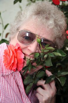 Woman with flower stem in her mouth