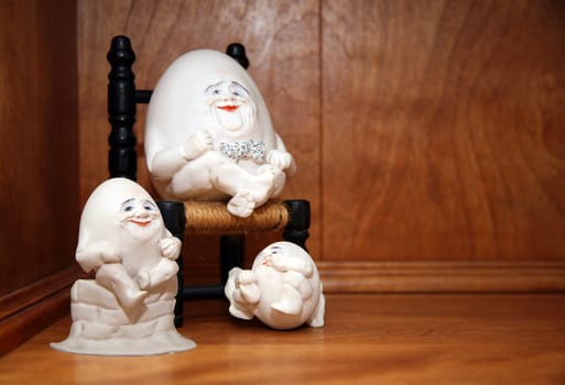 Cute little egg people sitting on a shelf