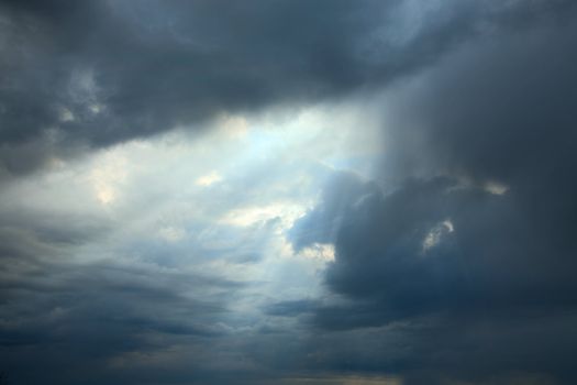 Sunshine making the way through dark clouds