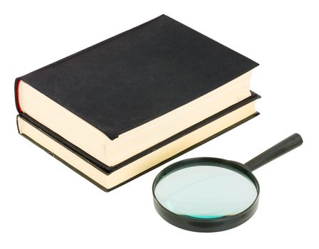 Books and magnifying glass on the white background