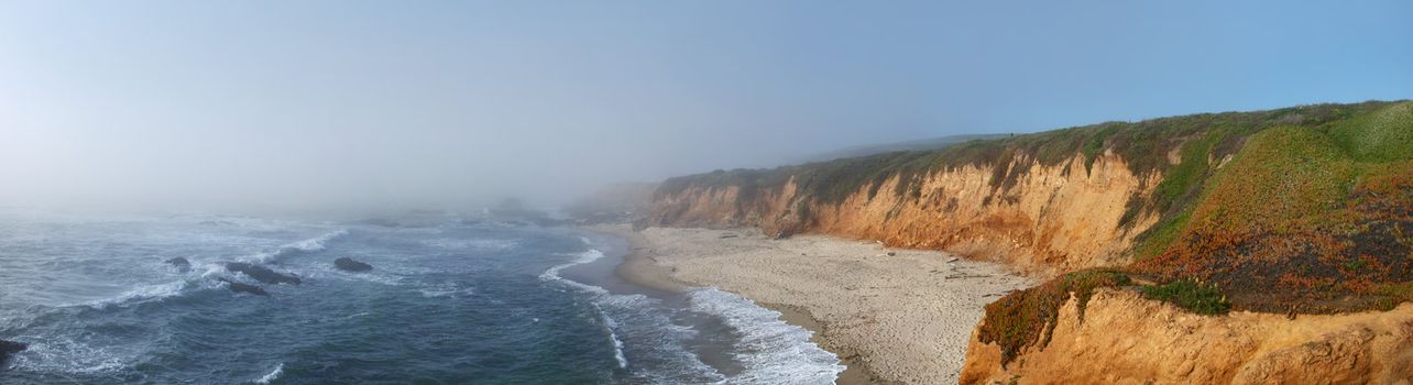 California coast with fog coming from the Pacific to the land.