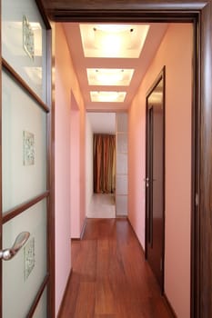 Long corridor with set of doors