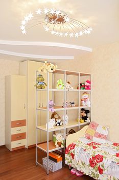 Children's room with toys and a bed