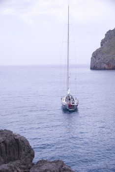 sailing boat in a lonley ocean bay in mallorca spain