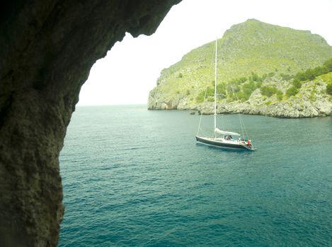 sailing boat in a lonley ocean bay in mallorca spain