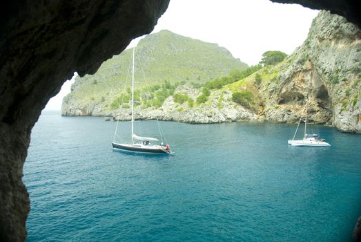 sailing boat in a lonley ocean bay in mallorca spain