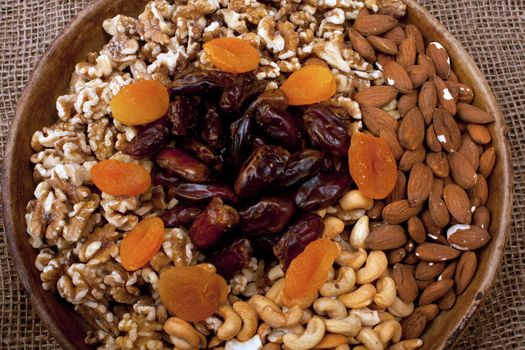 Tray with walnuts, almonds, cashews, dates and apricots