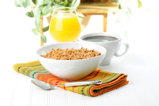 Healthy breakfast of cereal, orange juice and coffee.