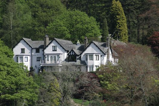 large white house amongst the trees