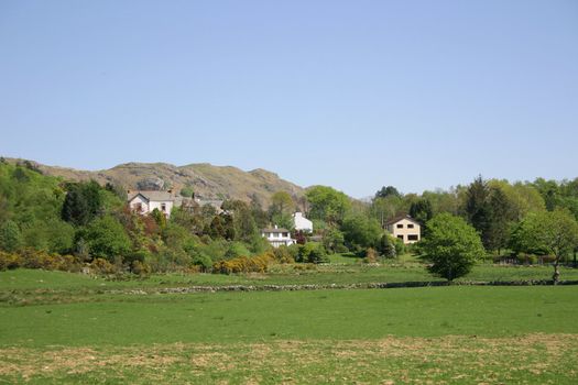 large houses in the middle of the countryside