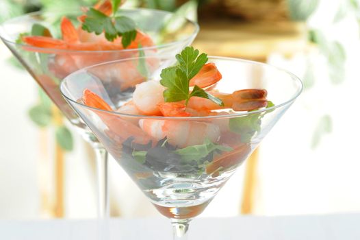 Tasty shrimp appetizer served in a cocktail glass.