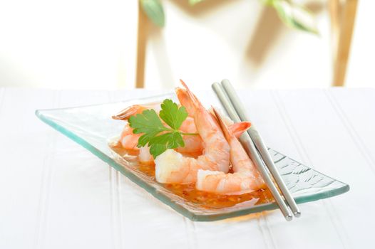Delicious oriental style shrimp appetizer with chopsticks.