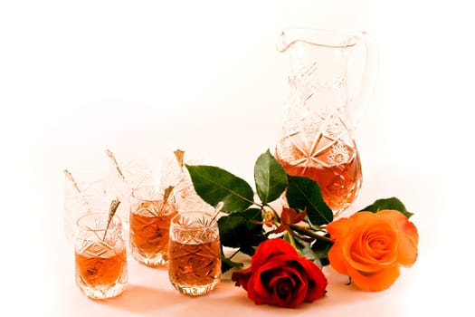 Turkish crystal teaset with can, tiny glasses and roses on white background
