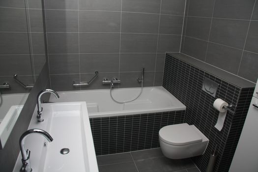 A modern bathroom in different shades of grey