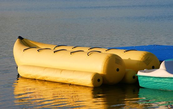 banana boat ride sitting on the water in the morning light