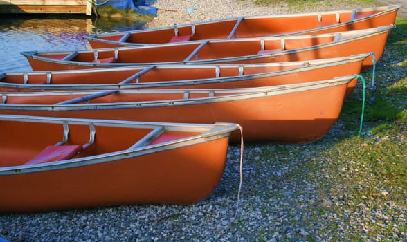 canoes on the river bank lit with the morning light