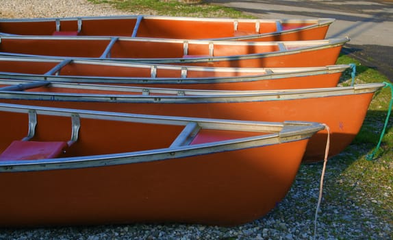 canoes on the river bank lit with the morning light