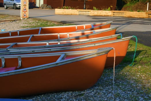 canoes on the river bank lit with the morning light