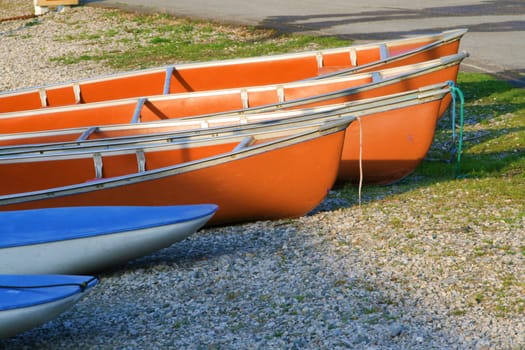 canoes on the river bank lit with the morning light