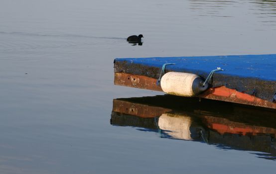 wooden jetty at the lakes edge